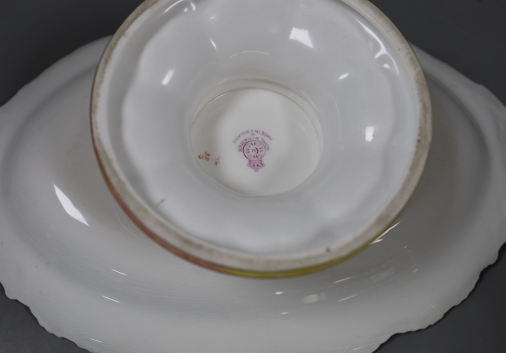 A Royal Worcester fruit painted footed dish, c. 1930, by T. Lockyer. 32cm wide